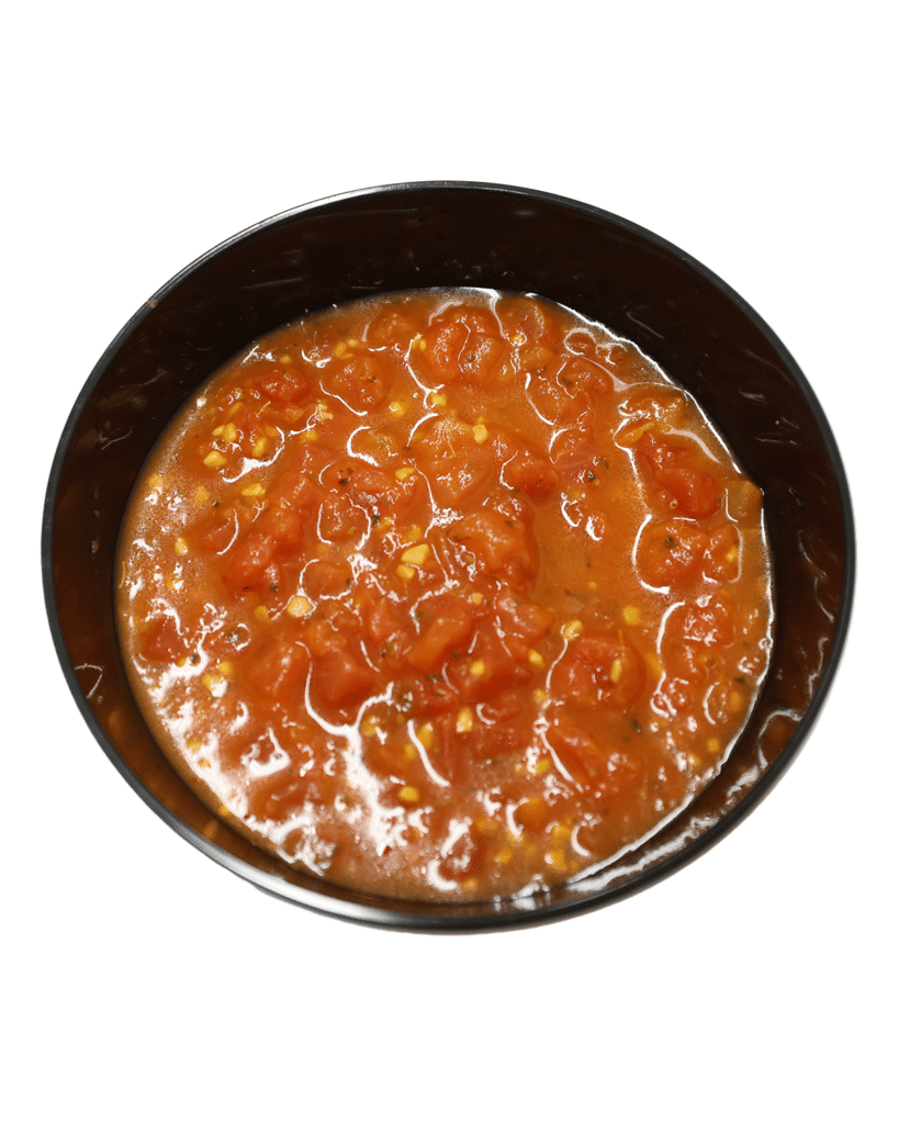 A bowl of tomato sauce featuring Petite Diced Tomatoes with Garlic and Olive Oil on a white background.