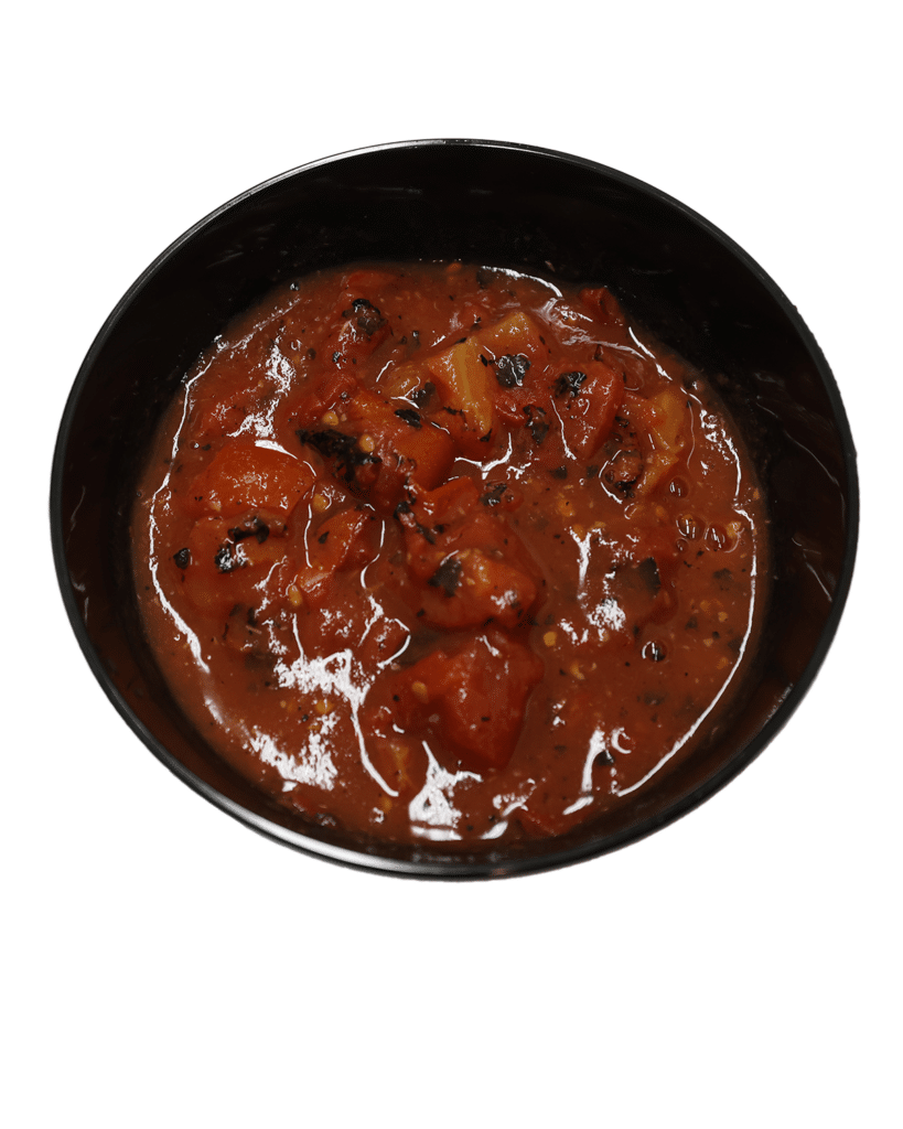 A flavorful stew with fire roasted diced tomatoes and garlic served in a white bowl on a white background.