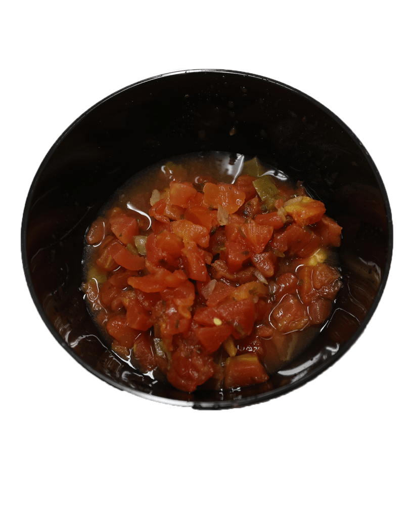 A bowl with tomato sauce made using Mexican style diced tomatoes.