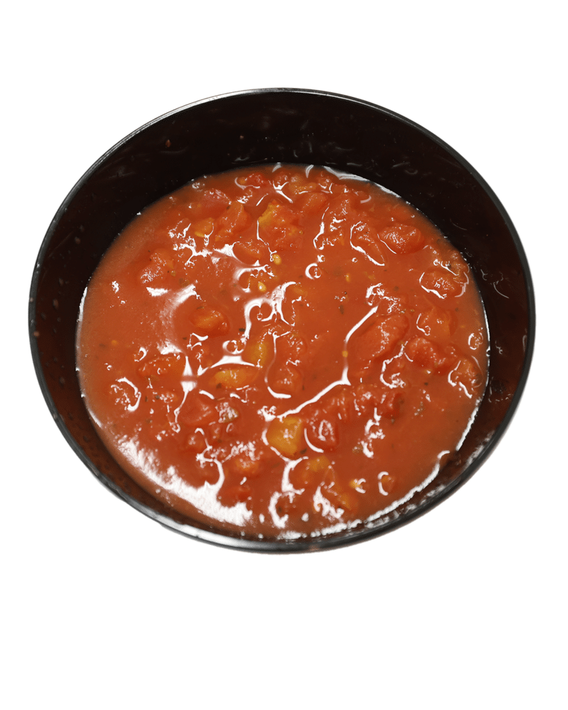 A bowl of Southwestern tomato sauce on a white background.