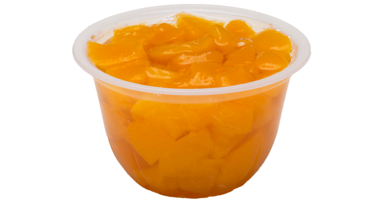 A container with diced oranges in real fruit juice.