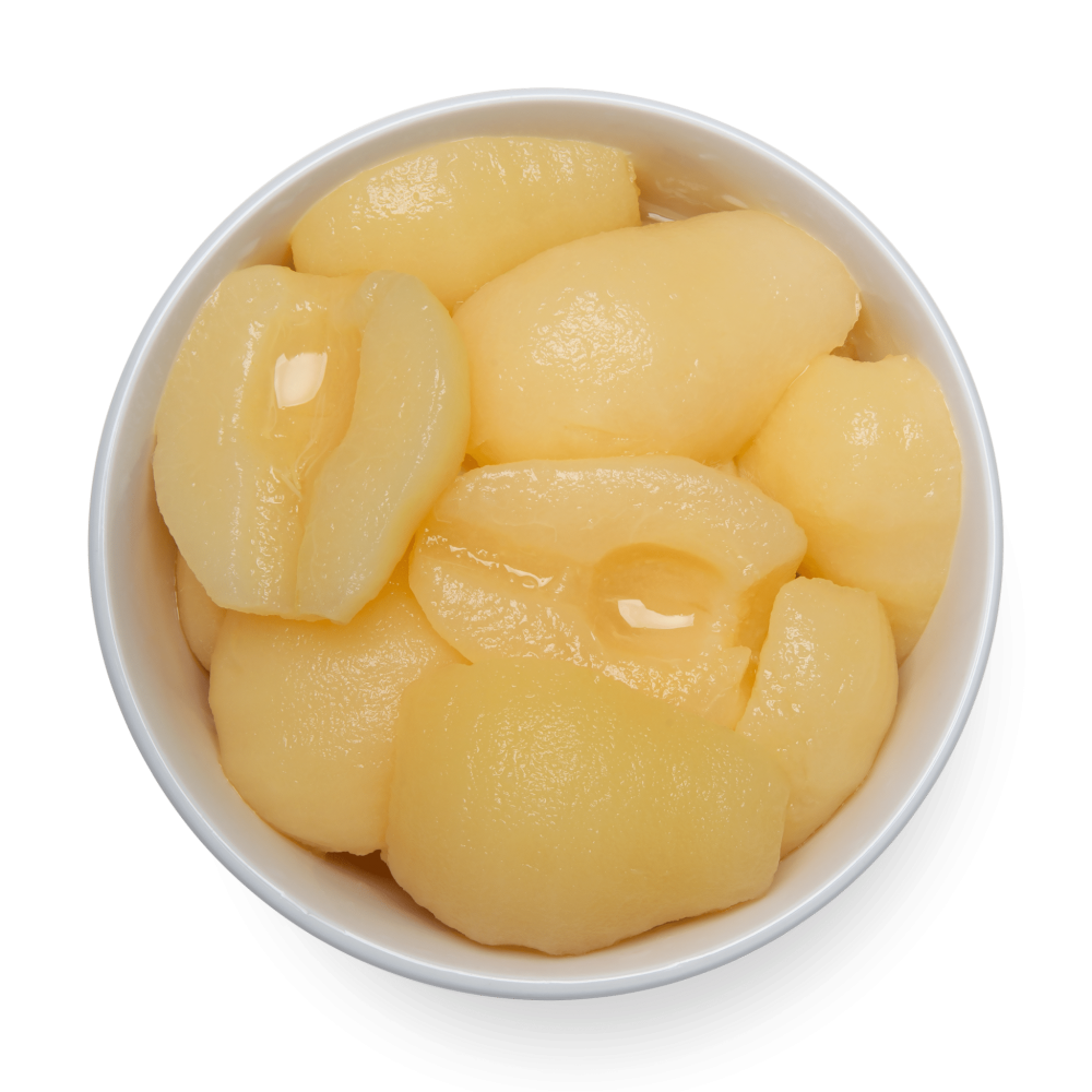 Peaches in a bowl on a black background, pear halves.