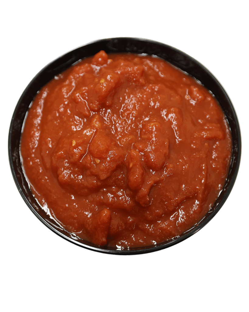 A bowl of sauce made with Coarse Ground Tomatoes and Puree, on a white background.