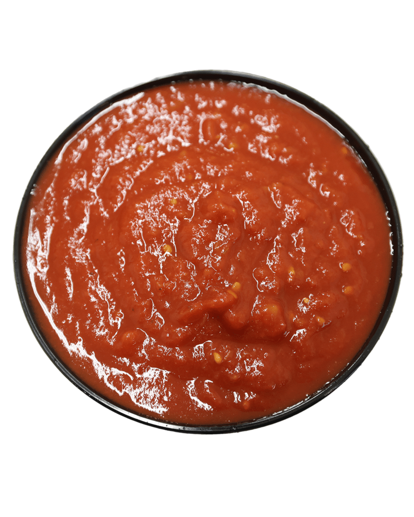 A bowl of organic tomato sauce on a white background.
