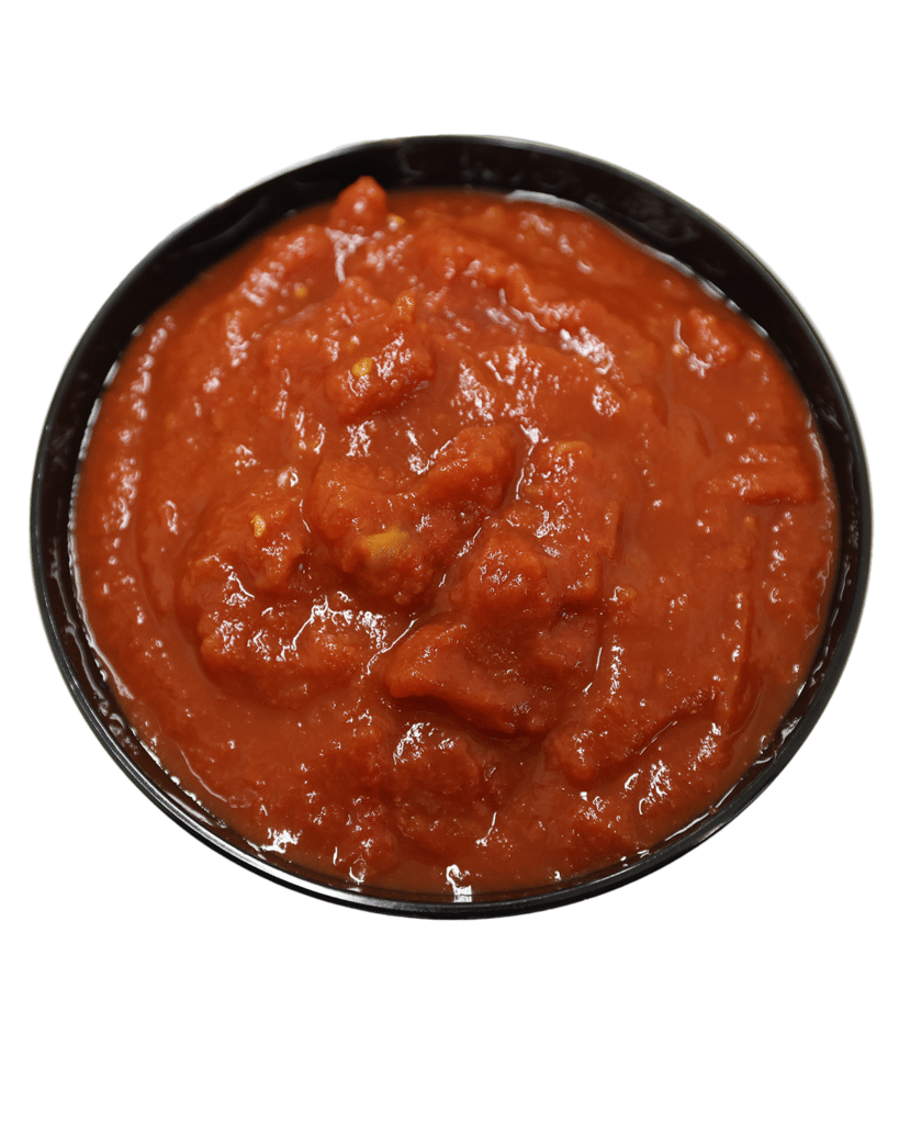 A bowl of tomato sauce made from #10 ground unpeeled tomatoes on a white background.