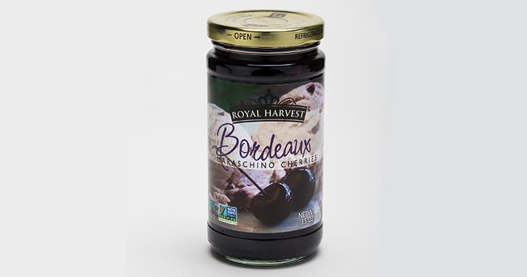 A 13.5 oz bottle of blackberry jam on a white background.