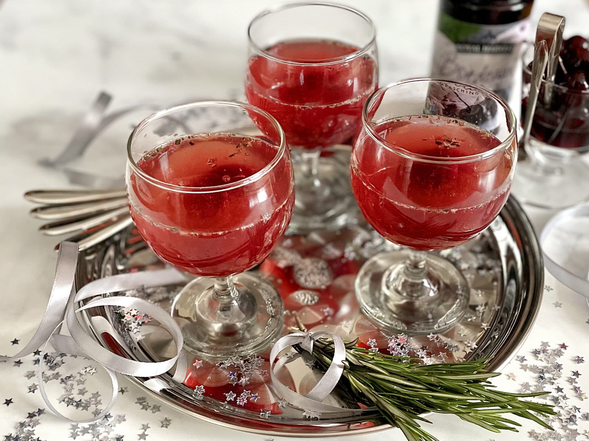 Three glasses of cranberry mulled wine.