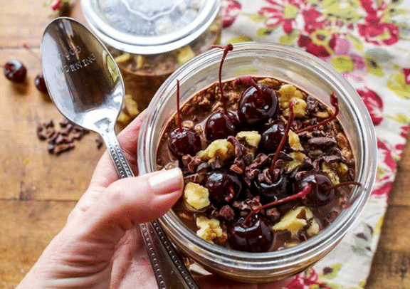 dark cherry chocolate overnight oats in bowl recipe photo