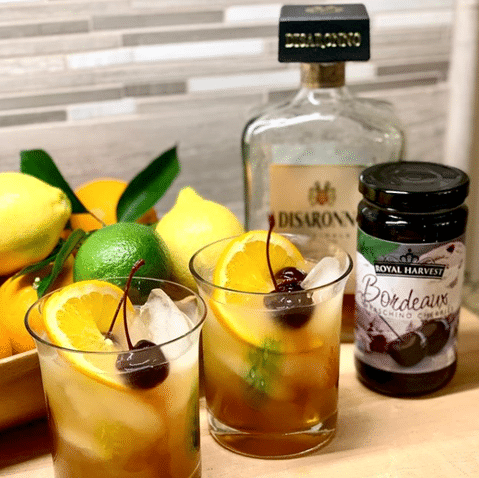 lemon cherry amaretto sours on countertop recipe shot